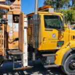 A National Crane 400A Series Boom Truck Or Crane Truck Working For The